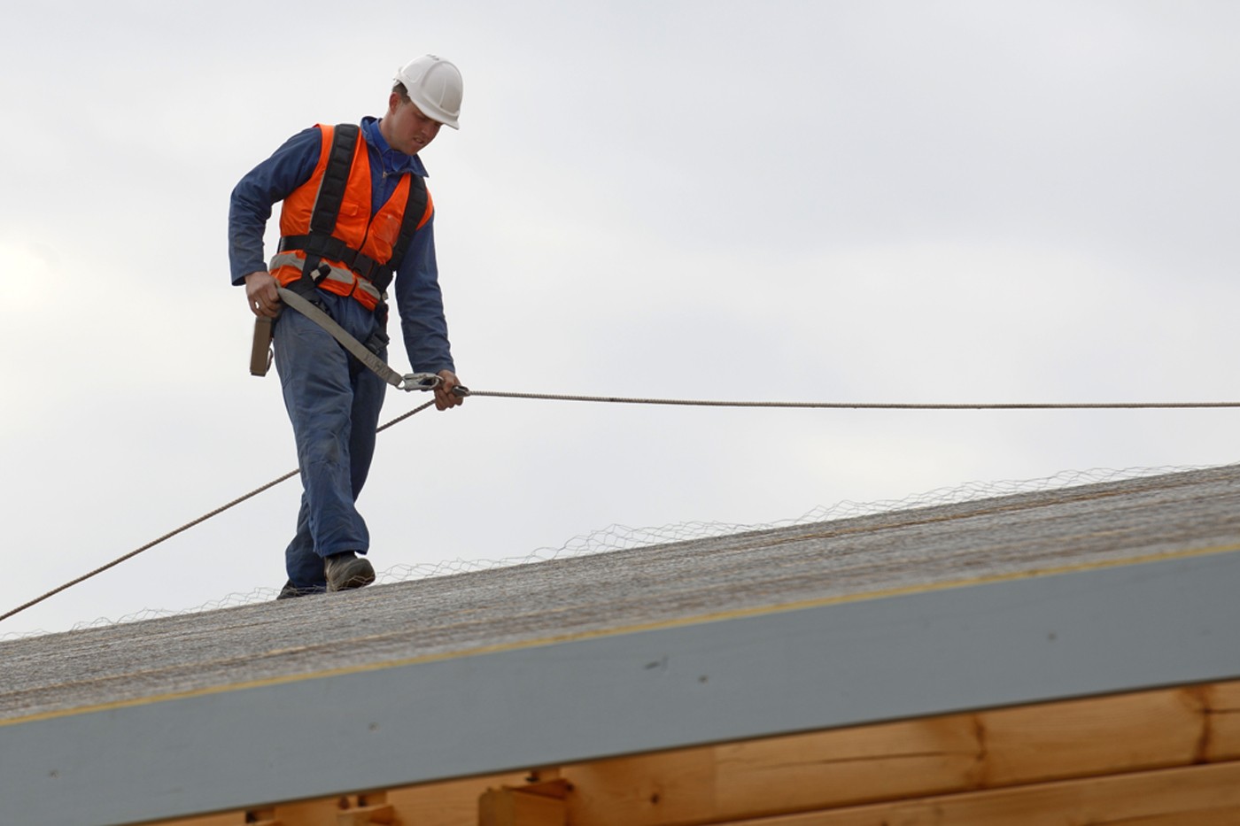 Safety equipment including helmet, gloves, and harness neatly arranged